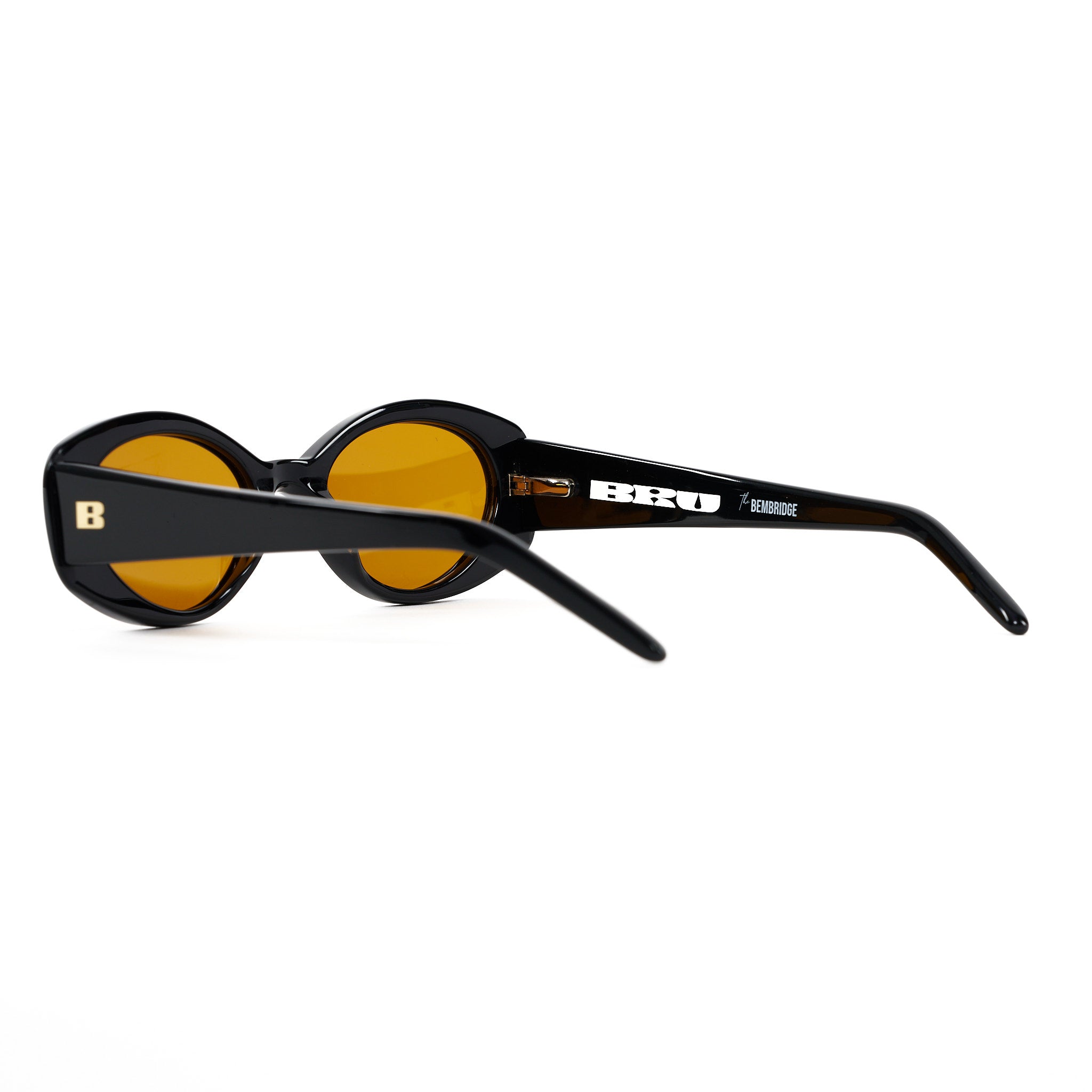 Thick framed oval sunglasses with an orange lens. Acetate Frames and Polarized lenses.